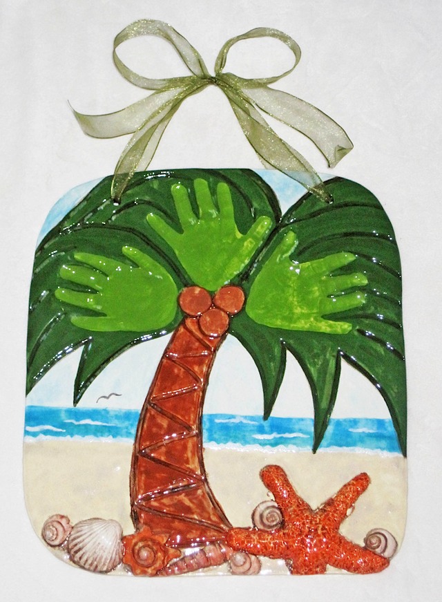 palm tree hand impression with shells